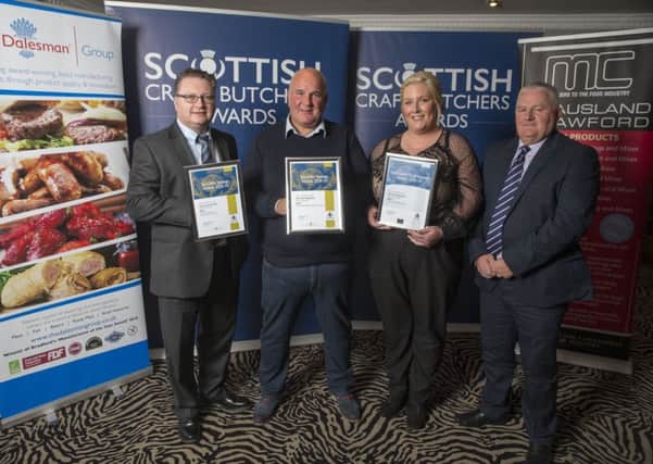 John Fleming receiving his awards from Scottish Craft Butchers evaluation contest sponsors, David Langley (left) from Dalesman and Robert Watson (right) from McAusland Crawford