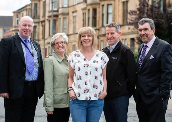 From left: Councillor Kenny McLean, city convener for neighbourhoods, housing and public realm at Glasgow City Council; Margaret McIntyre, chairman of Southside Housing Association; tenant Myra Thompson; Paul Hush, development officer at Southside Housing Association and Gavin Taylor, managing director of CBS.     Photograph by Martin Shield.