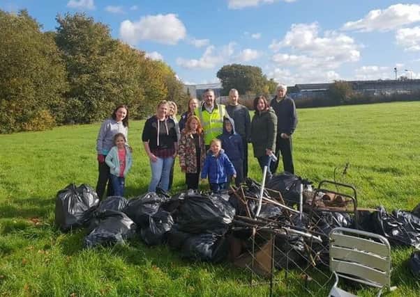 Volunteers with some of the rubbish removed from Viewpark Glen