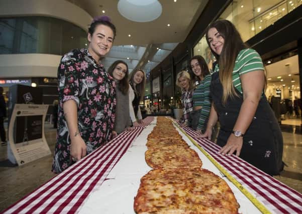 Silverburn dishes up Scotland's longest pizza to hungry freshers to kick of the centre's student celebrations. 

Photo: Colin Templeton