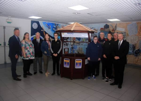New College Lanarkshire staff and students hand over wishing well to Rotary Club of Cumbernauld which is located in Cumbernauld town centre to raise funds for good causes