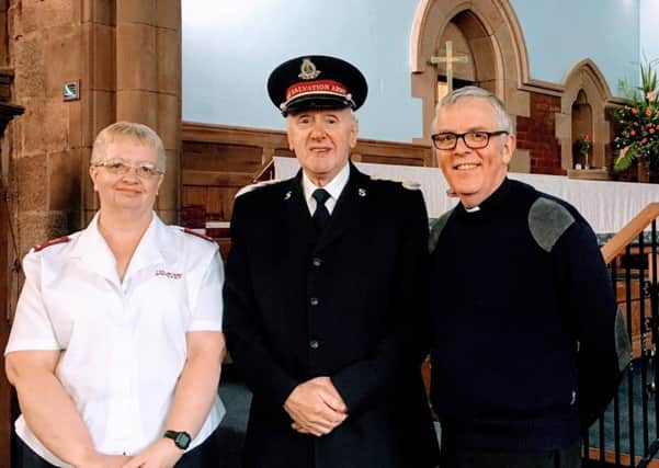 The Rev Richard Kilgour of Holy Trinity Church with the Salvation Armys Janie Paterson and Motherwell Band Master William Friend