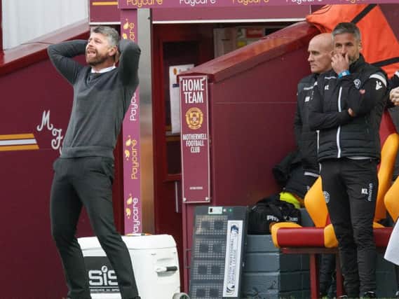 Watching Saturday's defeat by St Johnstone was agony at times for Stephen Robinson and his assistant Keith Lasley (Pic by Ian McFadyen)