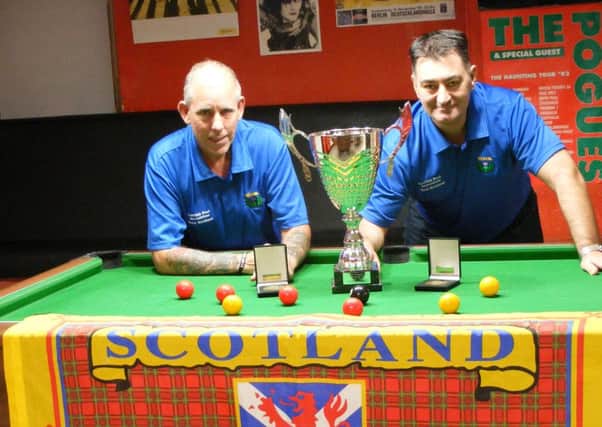 Scotland Masters team members Robert Hoey (left) and Hugh McBride with the European Championship trophy they won earlier this year.