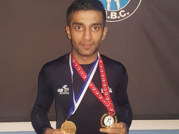 Aqeel with his medals