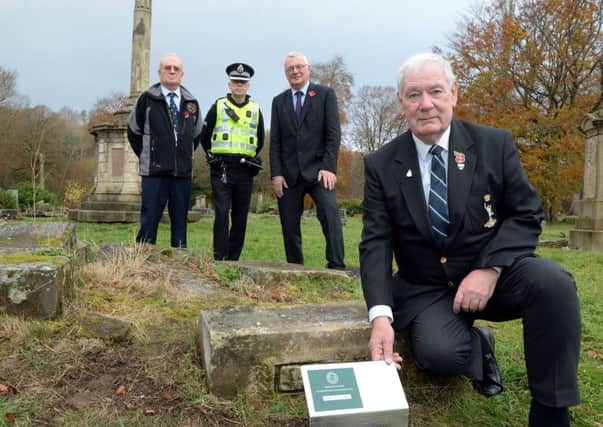 British War Graves volunteer Bill May (front) at the Globe Cemetery with  (l-r) Commonwealth War Graves Commission regional manager Iain Anderson, Inspector Keith Campbell and North Lanarkshire Council leader Jim Logue