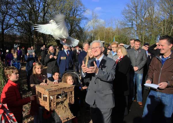 Cumbernauld Environmental Society (CES) chairman Bobby Johnstone releases a bird at the opening of Cumbernauld Community Memorial Peace Garden in Greenfaulds