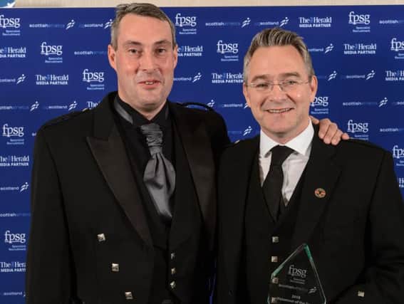Stephen (right) is congratulated by Scottish Athletics chief executive Mark Munro (pic by Bobby Gavin)