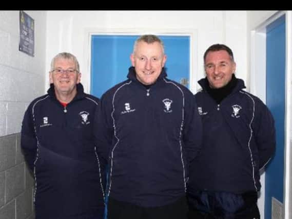 Lanark United manager Colin Slater (centre) and his backroom staff
