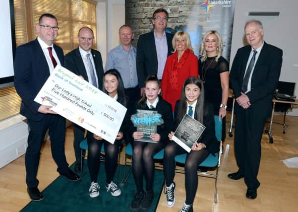 The Our Ladys High winning team of Erin OBrien, Maria Roos and Lucy McNee with head teacher Danny McNulty, Councillor Frank McNally (convener of Education), Dragons Danny Murphy, Scott Webb, Denise Canning and Joanne Telfer, and Councillor Allan Graham (convener of the Enterprise and Housing Committee)