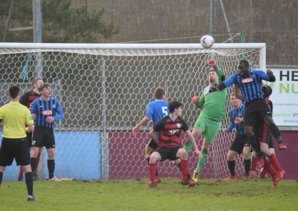 Christian Nade puts pressure on the Rob Roy defence during the draw with Troon