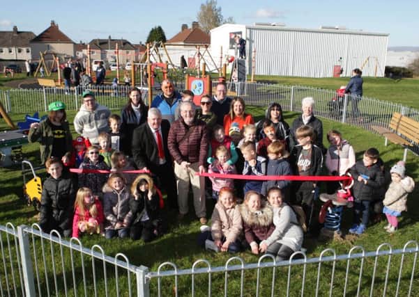 Thorniewood councillor Bob Burrows cuts the ribbon to officially open the play park in Birkenshaw