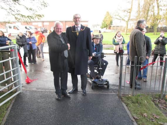 Provost McAllan shakes hands with Community Council chair Jim Burt
