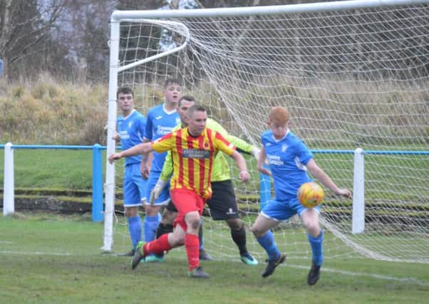 Mark Smith handles to concede the penalty from which Chris Zok put Rossvale ahead at Lanark. (Pic courtesy of HT Photography/@dibsy_)