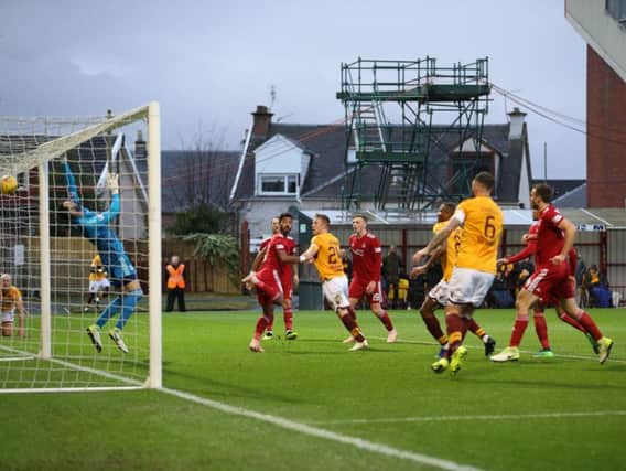 Danny Johnson heads in his second goal against Aberdeen (Pics by Ian McFadyen)