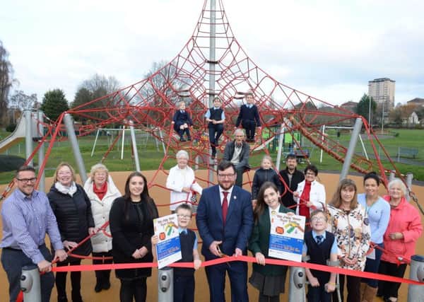 Councillor Paul Kelly cuts the ribbon to officially open The  Steel Town Play Park