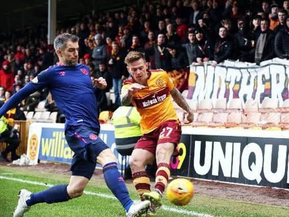 Injured Craig Tanner (right) hasn't played for Motherwell since March
