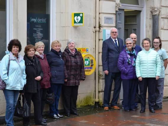 Community Council and Crossroads Cafe members gather at the new lifesaving unit