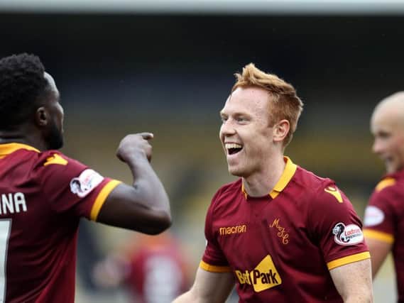 Goalscorer Danny Johnson celebrates with team-mate Gael Bigirimana after scoring the winning goal in Motherwell's 1-0 Betfred Cup second round success against Livingston at the Tony Macaroni Arena on August 18.