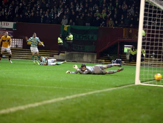 Celtic keeper Craig Gordon is left sprawled on the ground after Danny Johnsons stunning 87th minute strike into bottom corner (Pics by Ian McFadyen)