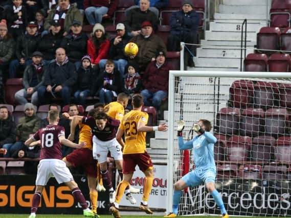 The ball is on its way into the net from Hearts' Peter Haring for the opening goal on Saturday (Pic by Ian McFadyen)
