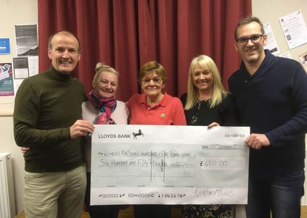 Charity cheque...members of Kirkton Players in Carluke were delighted to hand over a bumper cheque to local Womens Aid representatives on Monday night.