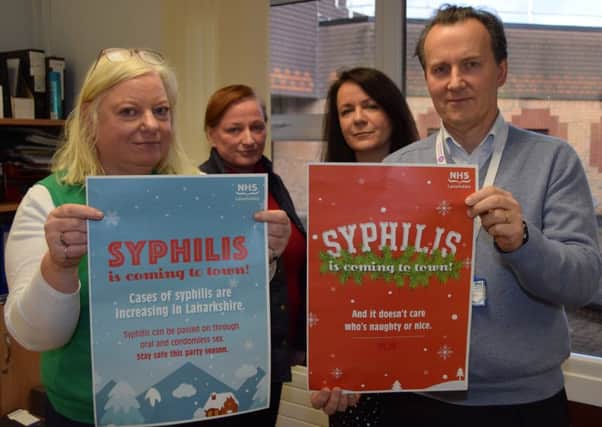 Showing off some examples of the social media images being used to raise awareness of syphilis are (l-r) Dr Anne McLellan (lead clinician for the Lanarkshire Sexual Health Service), Trish Tougher (Lanarkshire BBV prevention & care network manager), Jacqueline Martin, (senior health promotion officer), Dr John Logan (consultant in public health medicine)