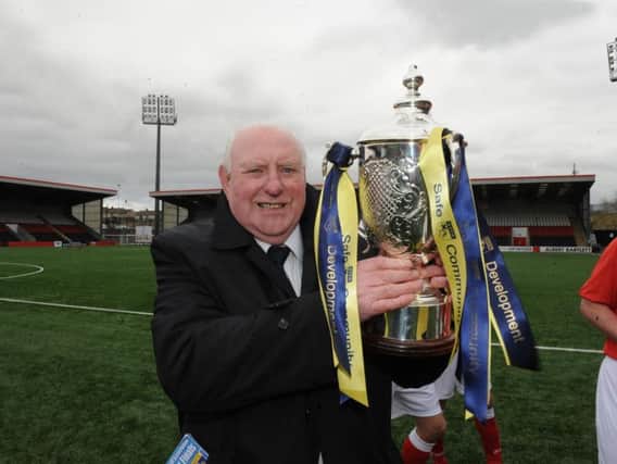 Gerry Marley celebrating Scottish Cup success with Campsie Black Watch in 2013 (pic: Jamie Forbes)