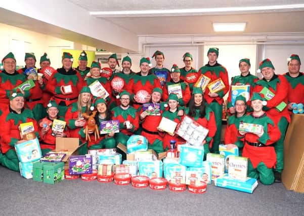 The McDermott Group elves delivered Christmas parcels for children supported by Action for Childrens North Lanarkshire Young Carers.