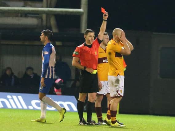 Curtis Main holds his head in his hands after being red carded against Kilmarnock by referee Steven McLean.