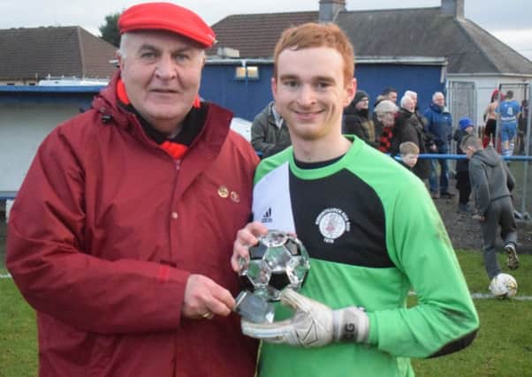 Rob Roy keeper Craig Gordon receives his man of the match award from sponsor Malcolm Campbell