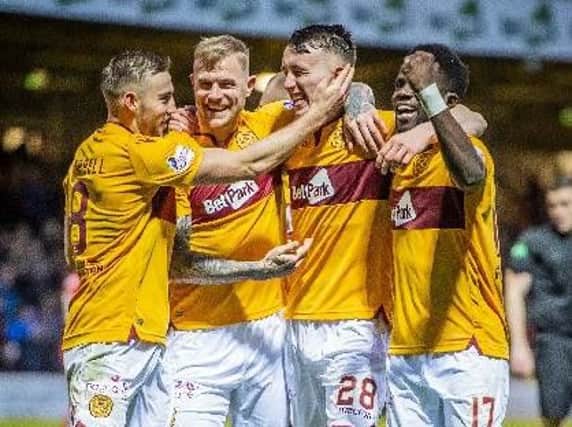Motherwell ace Allan Campbell (left) hopes to be celebrating a Scottish Cup triumph this May with team-mates Richard Tait, David Turnbull and Gael Bigirimana