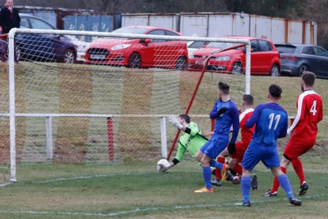The ball hits the Forth Wanderers net as Ciaran Lafferty opens the scoring for Carluke Rovers on Saturday (Pic by Kevin Ramage)
