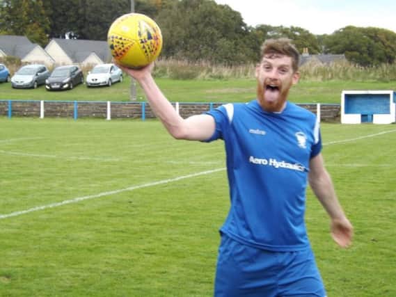 Hugh (Shug) Kerr celebrates with the match ball after scoring a hat-trick against Ardeer Thistle earlier this season