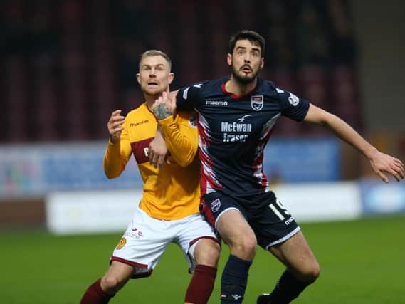 Ross County's two-goal hero Brian Graham (right) with Motherwell's Richard Tait (Pic by Ian McFadyen)