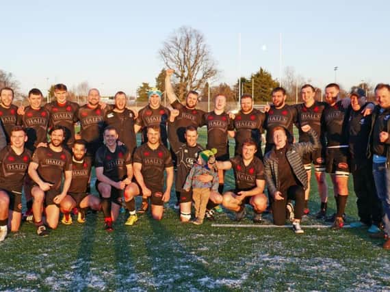 Biggar Rugby Club head coach Gary Mercer (second right) and his jubilant players celebrate their 12-10 success at Highland on Saturday (Pic by Nigel Pacey)