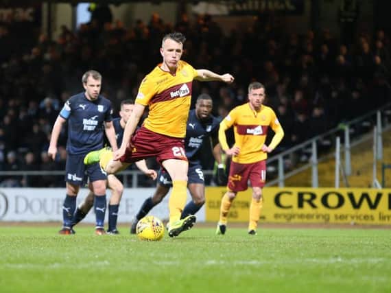 David Turnbull fires in Motherwell's winning goal at Dens Park from the penalty spot (Pic by Ian McFadyen)