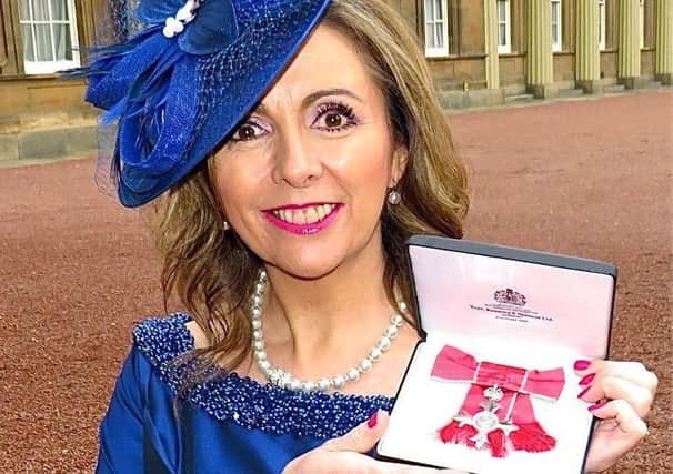 Carluke's Gill Murray with her MBE for her charity fundraising..