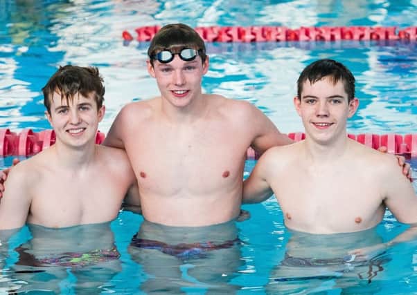 Duncan Scott with Cumbernauld swimming hopefuls Michael Flynn and Euan Macdonald during his session at The Tryst (pic by Stuart Nicol)