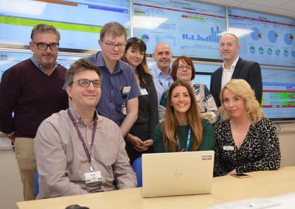 Front (left to right): Dr Gordon McNeish, consultant in emergency medicine, Donna McHenry, assistant service manager, and Karen Goudie, University Hospital Monklands chief of nursing service, with senior staff from University Hospital Monklands and NHS Lanarkshire