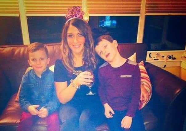 Arlene Mitchell with her sons Luca and Jay