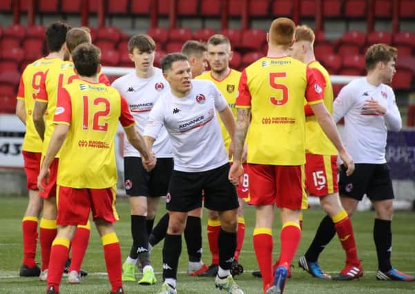 John Rankin shakes hands after completing his 600th senior appearance for Clyde against Albion Rovers (pic by Craig Black Photography)