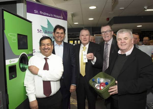 Nisa Local and Post Office owner Abdul Majid (left) is joined by Envipco president (l-r) Robert Lincoln, Richard Lyle MSP, Councillor Harry Curran and Hugh Gaffney MP to launch the reverse vending machine