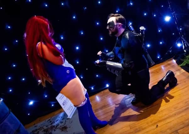 Ross Andrews gets down on one knee to propose to Rachel Kernan at the event in Edinburgh. Pic: Anthony Curley