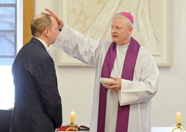 Archbishop Leo Cushley gave out ashes to MSPs and staff