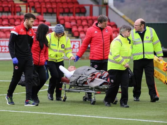 Clyde skipper Kevin Nicoll is stretchered off during last week's win over Albion Rovers (pic by Craig Black Photography)