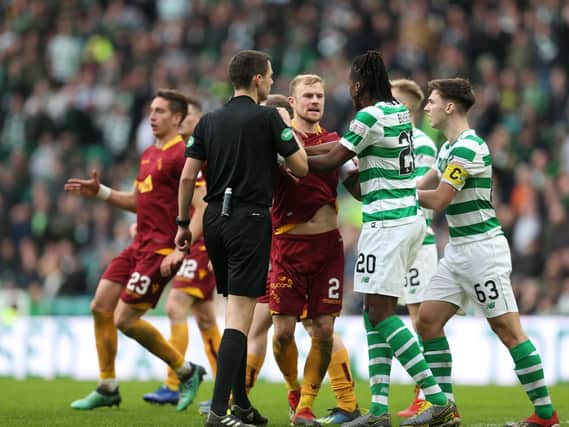 Players from both sides argue after Gboly Ariyibi's controversial strike for Motherwell at Celtic Park on Sunday (Pic by Ian McFadyen)