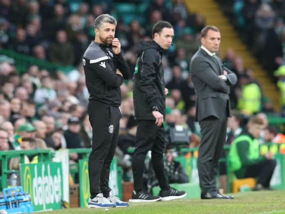 Stephen Robinson and Brendan Rodgers watch Sunday's action at Celtic Park (Pic by Ian McFadyen)