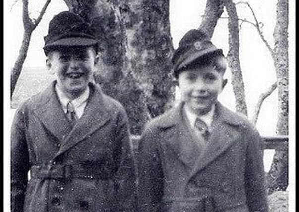 Respondant Matthew McKinnon (on the right) and his brother Andrew. The boys are wearing hats from German POWs they befriended who worked at Cowglen Military Hospital after the war. (Photo copyright: Matthew McKinnon).