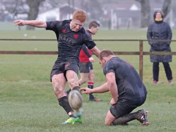 On a very windy day, Matthew Stewart kicked two conversions in Biggars 14-7 win over Lasswade which guaranteed promotion (Pic by Nigel Pacey)
